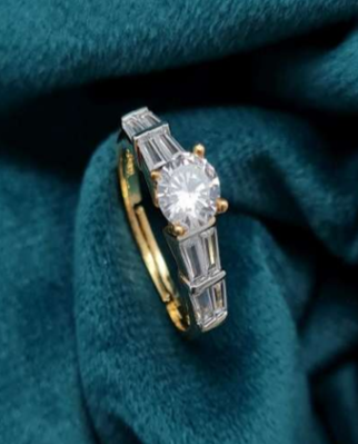 Gold-plated AD finger ring on rich teal velvet background