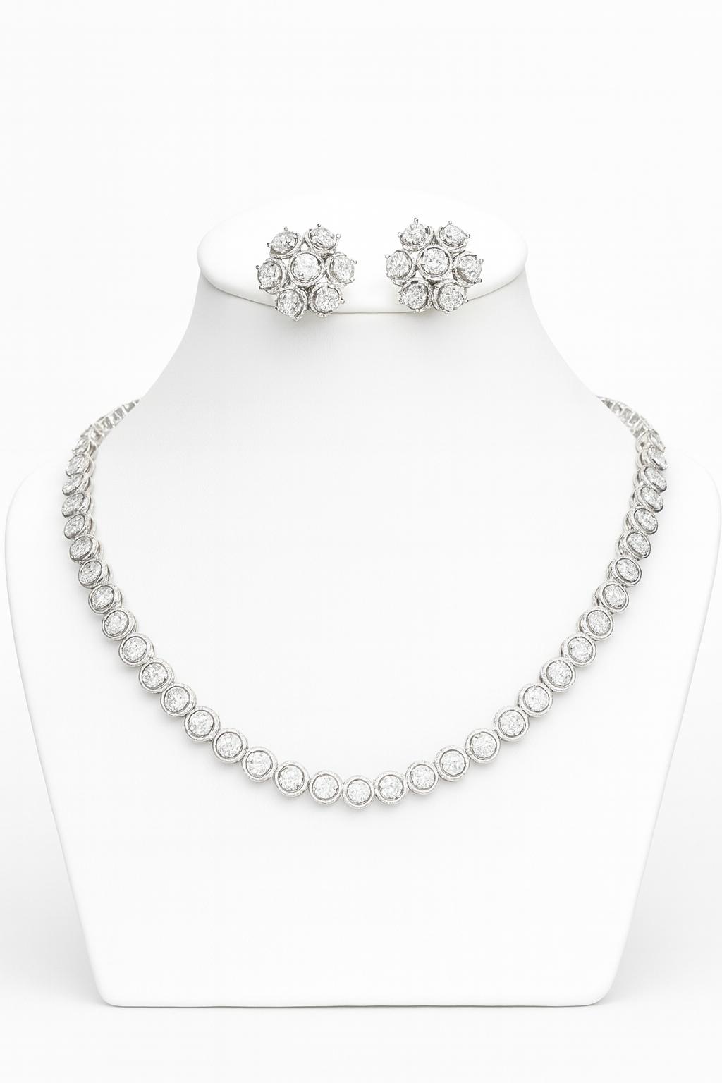 White CZ necklace set with silver finish, featuring a 20 cm delicate necklace and 1×1.5 cm matching earrings. Lightweight and refined festive jewelry.
