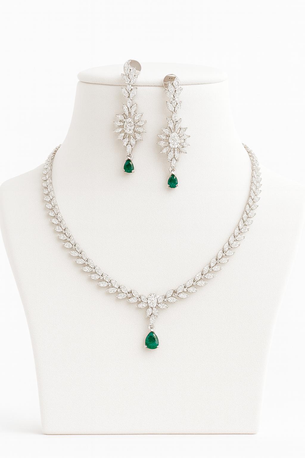 Green AD necklace set with golden white finish, featuring a 20 cm delicate necklace and 5 cm earrings. Elegant festive and gifting jewelry by Lavish Jewels.