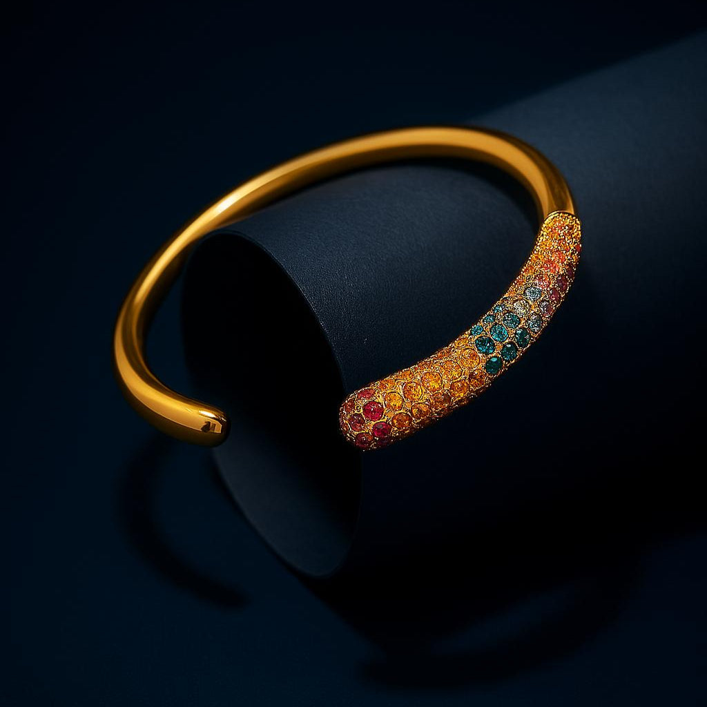 Gold bracelet with colorful gemstones on a dark background