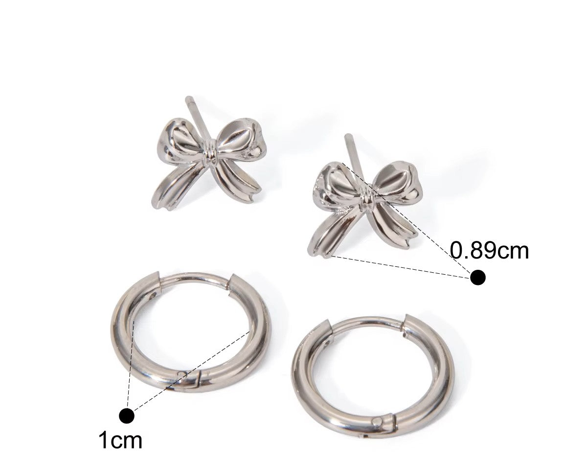 Bow-shaped earrings and hoop earrings with measurements on a white background