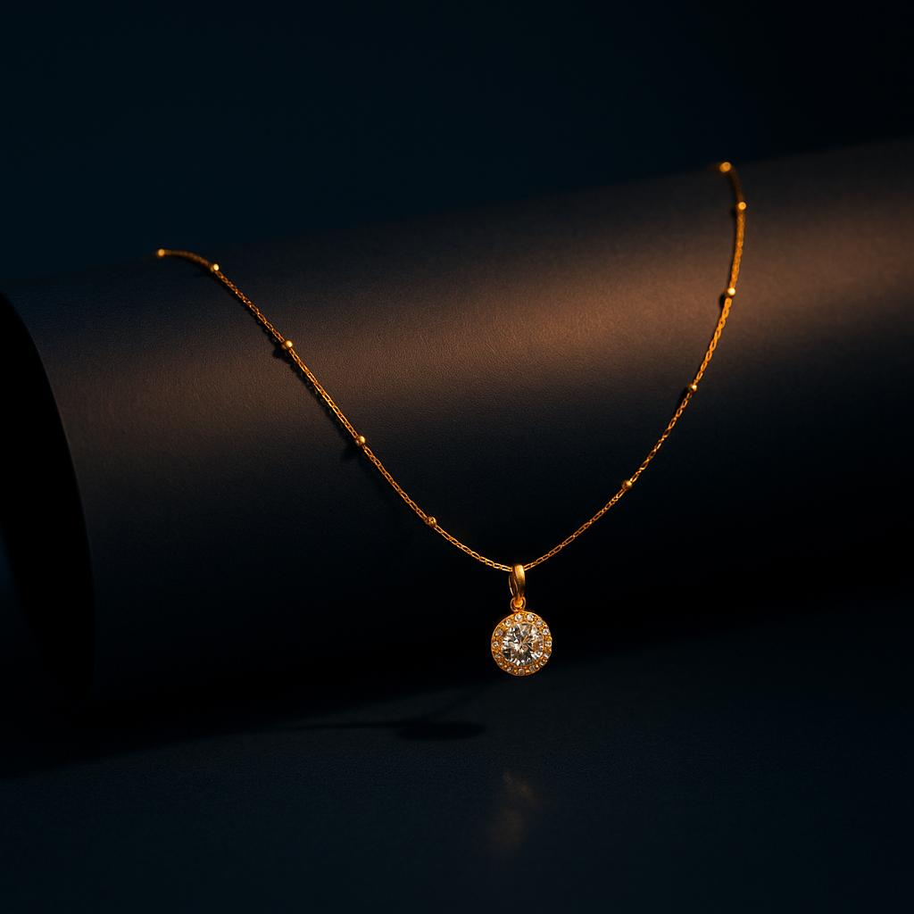 "Golden Wattle CZ Pendant Necklace in 18K PVD gold plated stainless steel on dark cylindrical surface with navy background"