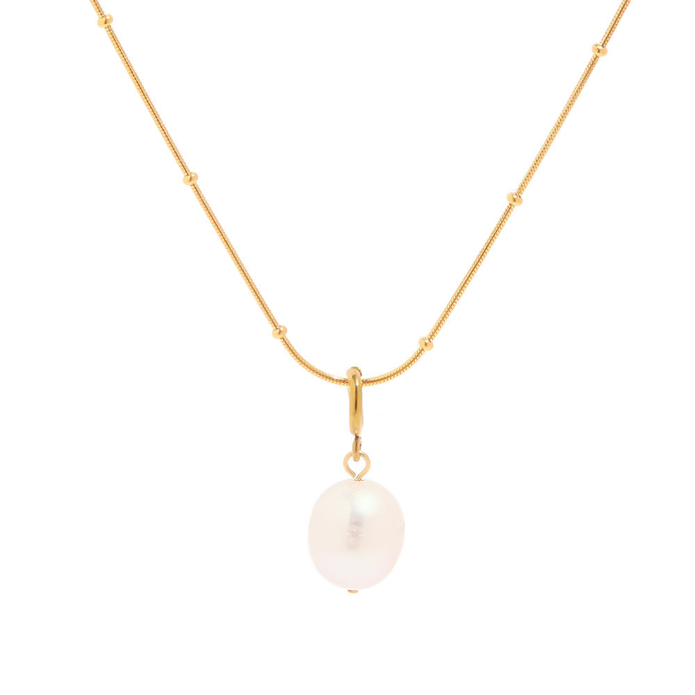 "Gilden Necklace with natural freshwater pearl pendant on bead-accented chain in 18K PVD gold plated stainless steel on white background"
