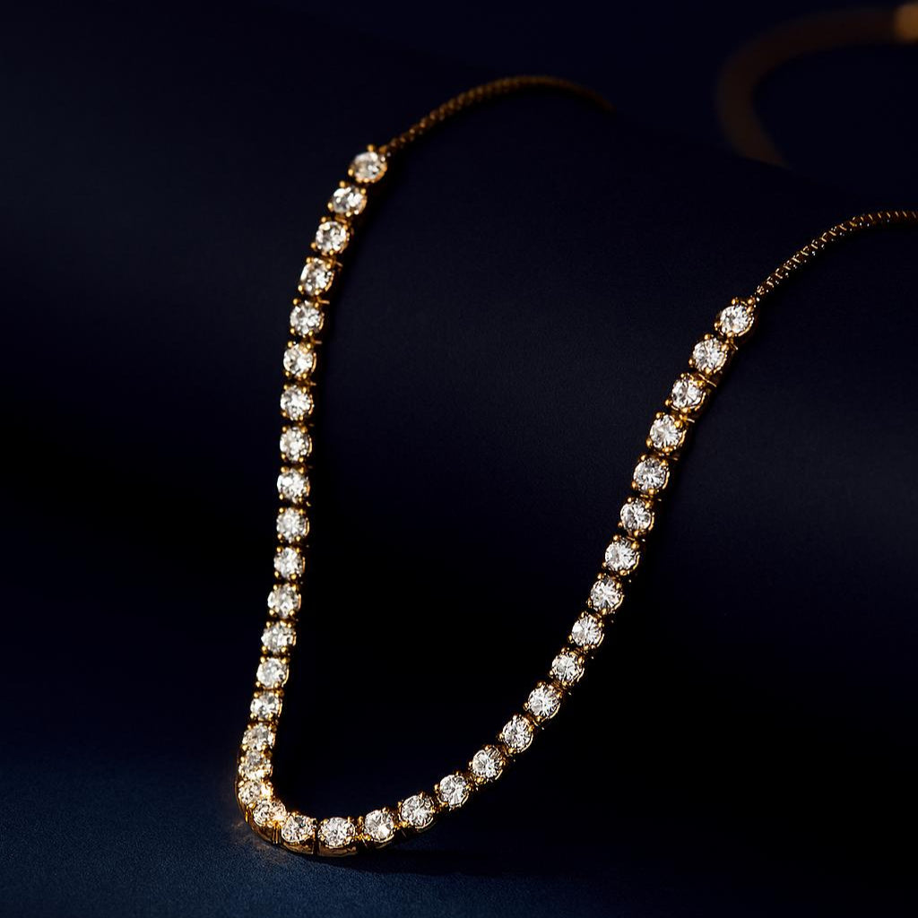 Breeze Gold Necklace – gold beaded snake chain displayed on black matte roll with navy backdropbackdrop