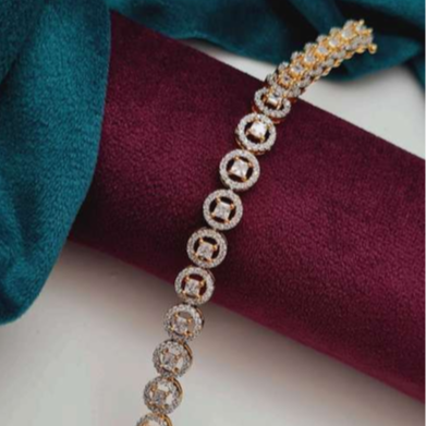Delicate gold-tone bracelet with round American diamond accents, featuring a lightweight 17.5cm design for elegant festive or everyday wear.