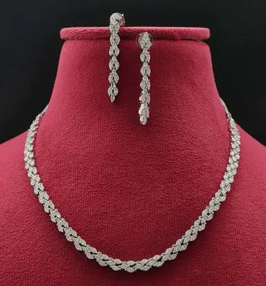 Baci AD Necklace Set - LAVISH JEWELSBaci AD Necklace Set – Silver Finish, Adjustable, Delicate Charm Design | Lavish Jewels