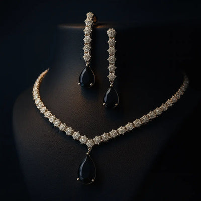 Elegant green stone CZ necklace set with matching earrings, featuring intricate silver-tone leaf detailing and round-cut American diamond embellishments.