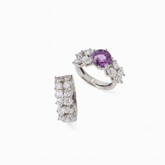 Flat lay of Goccia di Luce ring set with purple centre stone and CZ accents