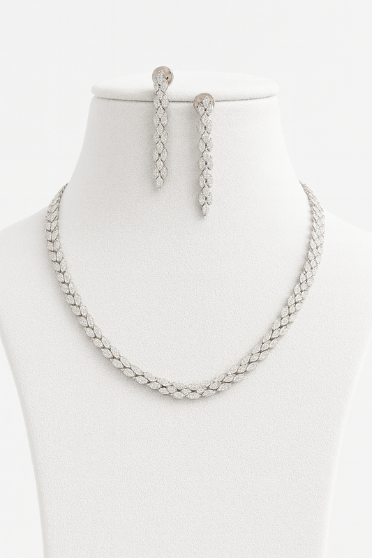 Silver finish AD necklace and earring set with delicate leaf-shaped CZ detailing. Lightweight, adjustable bridal and festive jewelry by Lavish Jewels.