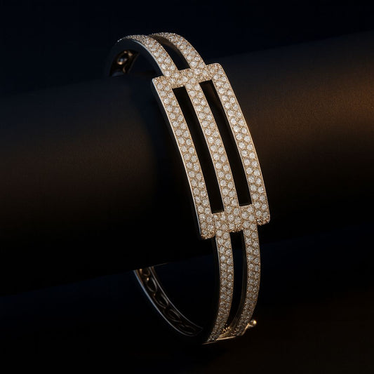 Luxurious editorial shot of Vibia Ash kada on black roll – glowing silver bangle