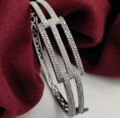 Vibia Ash kada on red velvet background – silver black oxidised CZ bracelet
