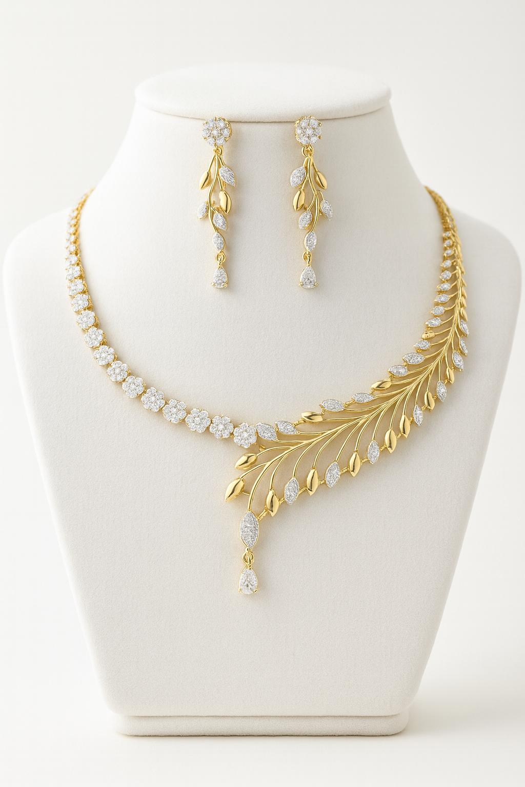 Golden white plated AD necklace set with delicate CZ stones. Includes a 25 cm necklace and matching 5 cm drop earrings. Lightweight, bridal-ready jewelry.