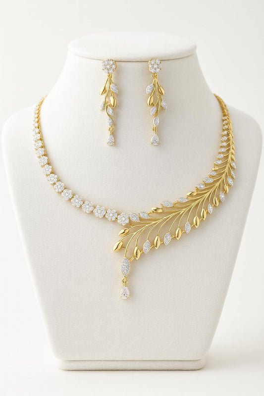 Golden white plated AD necklace set with delicate CZ stones. Includes a 25 cm necklace and matching 5 cm drop earrings. Lightweight, bridal-ready jewelry.