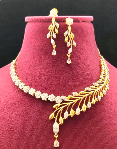 Golden white plated AD necklace set with delicate CZ stones. Includes a 25 cm necklace and matching 5 cm drop earrings. Lightweight, bridal-ready jewelry.