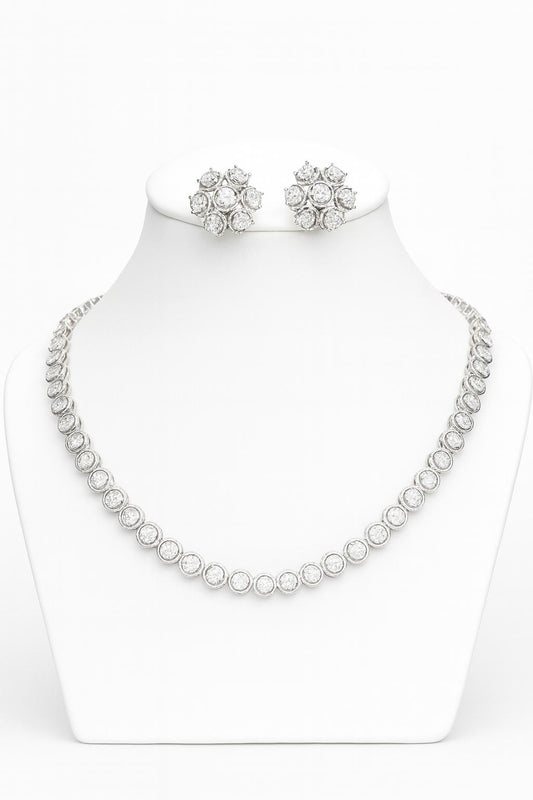 White CZ necklace set with silver finish, featuring a 20 cm delicate necklace and 1×1.5 cm matching earrings. Lightweight and refined festive jewelry.