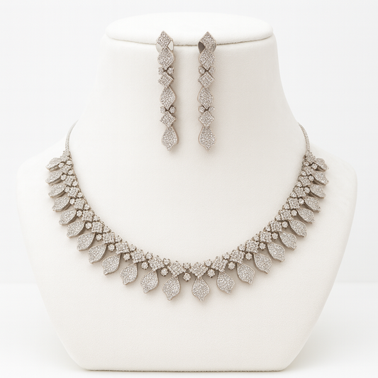 Angelo necklace set in white (WH) plating featuring shimmering AD stones and drop earrings displayed elegantly.