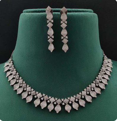 Angelo necklace set in white (WH) plating featuring shimmering AD stones and drop earrings displayed elegantly.