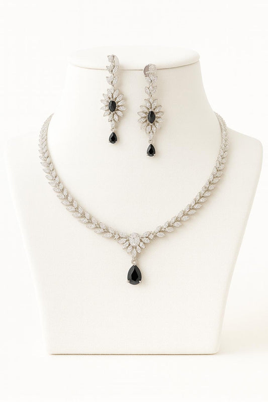 Black AD necklace set with golden white finish, featuring a 20 cm delicate necklace and 5 cm earrings. Elegant festive and gifting jewelry by Lavish Jewels.