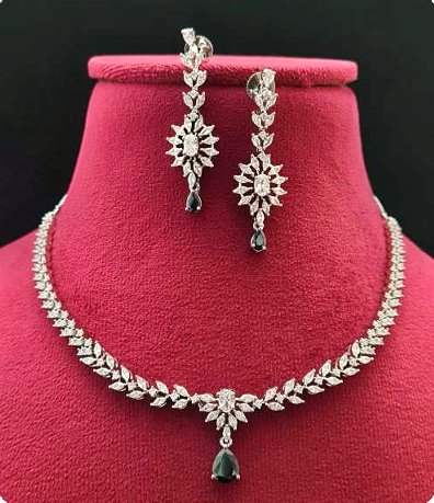 Black AD necklace set with golden white finish, featuring a 20 cm delicate necklace and 5 cm earrings. Elegant festive and gifting jewelry by Lavish Jewels.