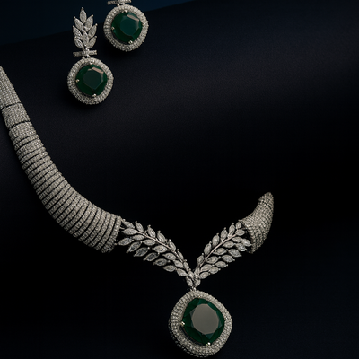 Artistic flatlay of Saanjh green CZ necklace set on black background with elegant shadows