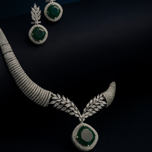 Artistic flatlay of Saanjh green CZ necklace set on black background with elegant shadows