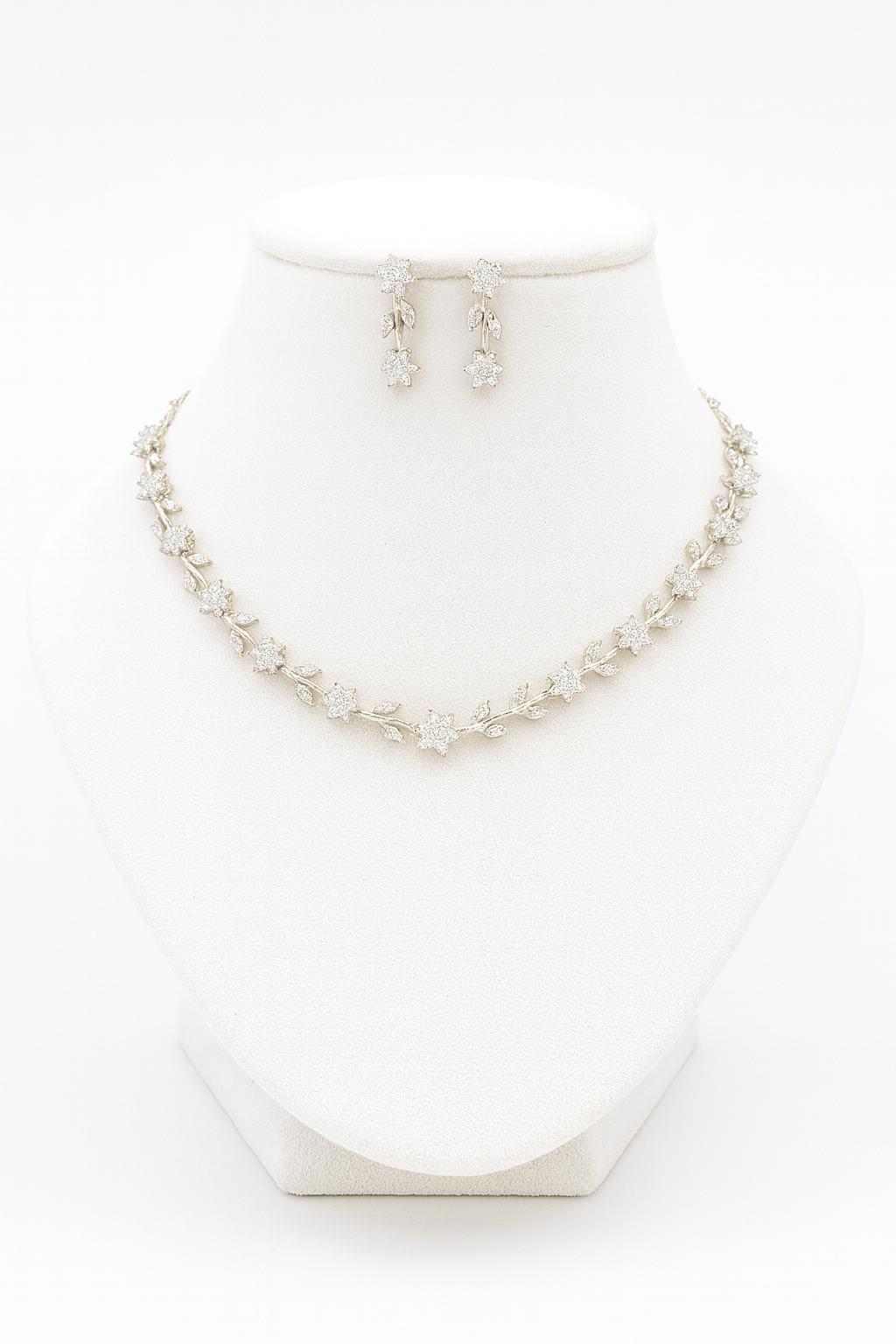 Venezia Shine white CZ floral necklace and earring set shown on white bust stand against white background