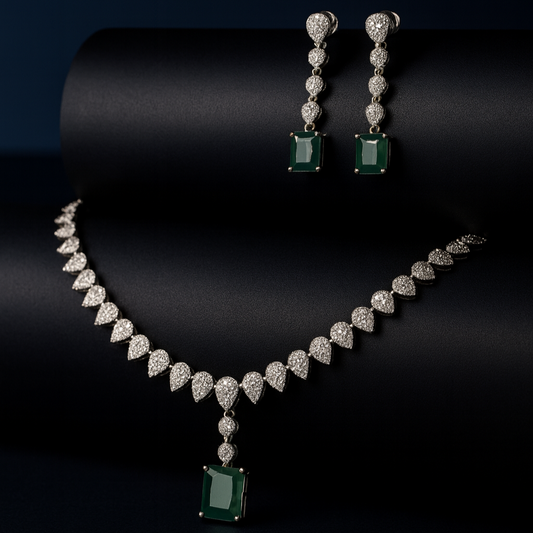 Vita emerald green AD necklace and earring set on black bust stand with black background
