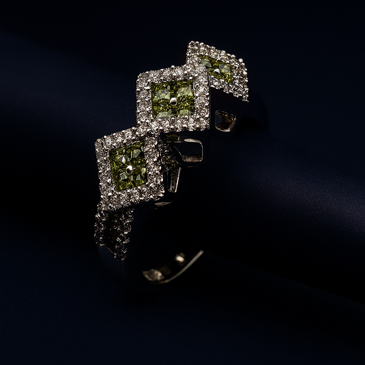 Elegant close-up of ring with three invisible set green squares on dark backdrop