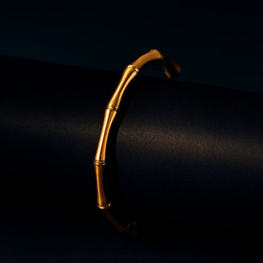 Gold bracelet on a black background