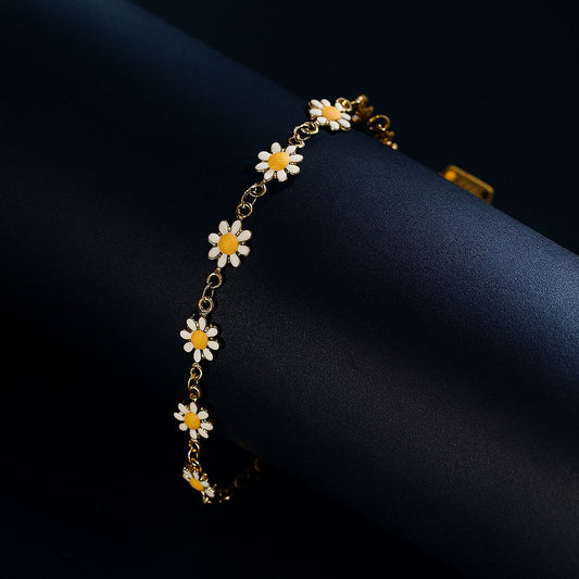 Bracelet with flower-shaped charms on a dark background
