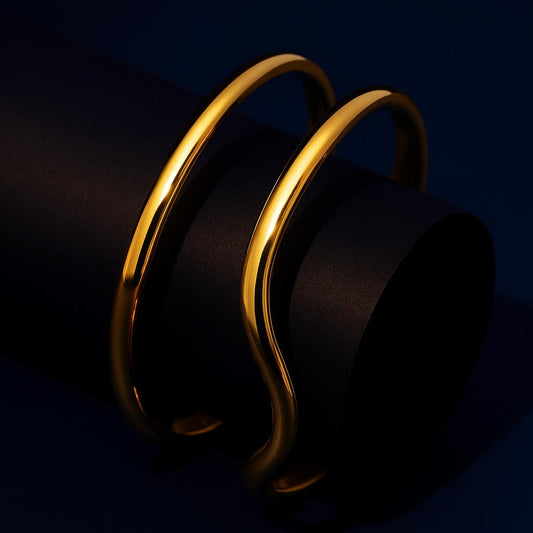 Gold bracelet on a black background