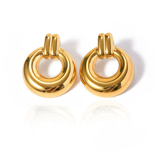 Pair of gold hoop earrings on a white background