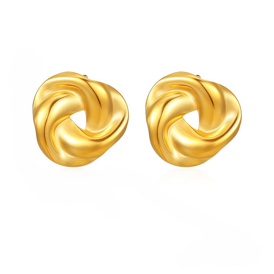 AURA Twist Gold Stud Earring – single earring in sculptural interwoven design on dark cylindrical surface