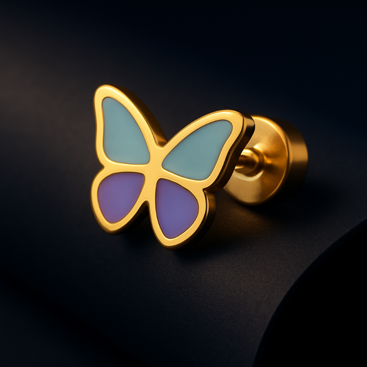 Butterfly-shaped earring with gold frame, blue and purple wings on a black background