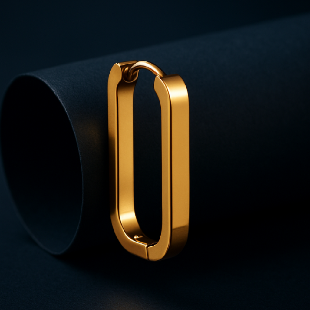 Gold hoop earring on a dark background