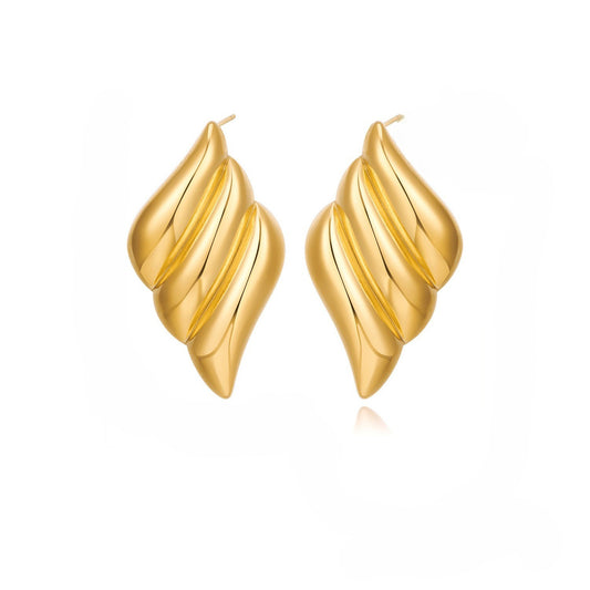 Gold leaf-shaped earring on white background | Lavish Jewels