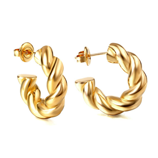 Pair of gold hoop earrings on a white background