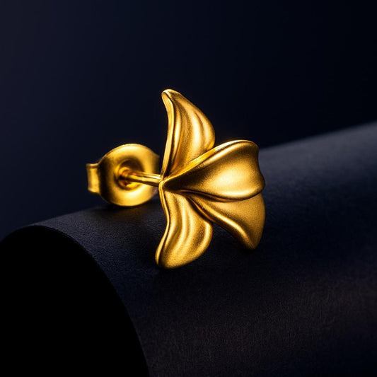 Gold earring on a black background