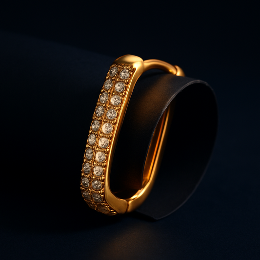 Gold ring with embedded diamonds on a dark background