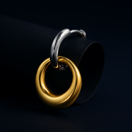 Gold and silver ring design on a black background