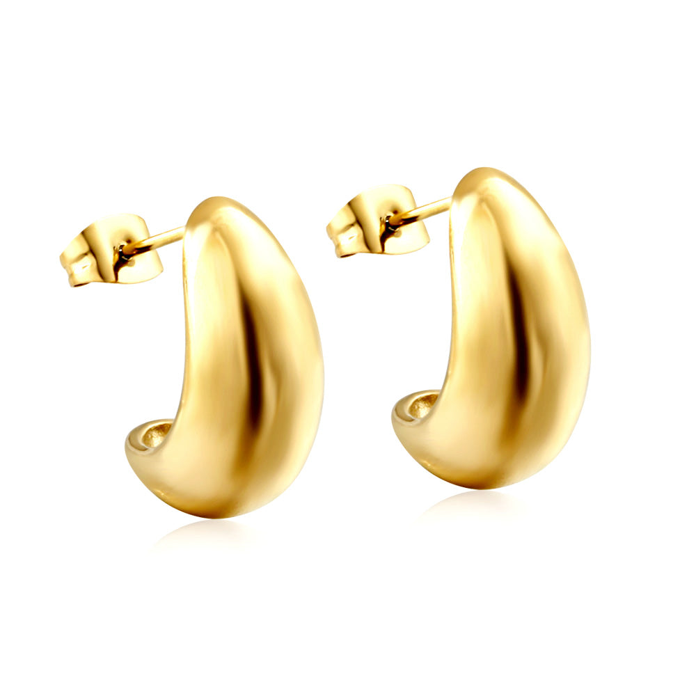 Gold hoop earrings on a white background