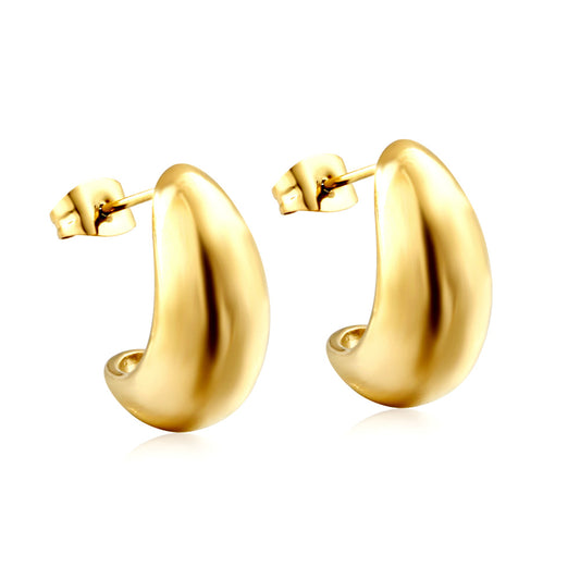 Gold hoop earrings on a white background