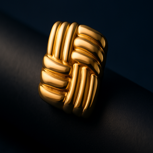 Gold knot ring on a dark background