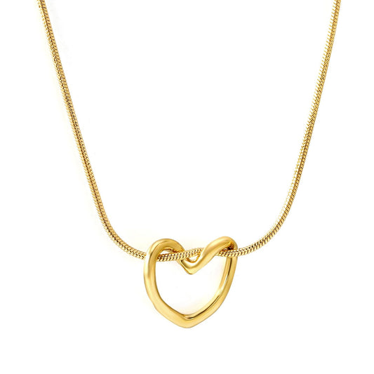 "Prism Heart Pendant Necklace in 18K PVD gold plated stainless steel on white background"