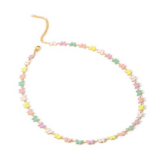 "Butterfly Choker Necklace in 18K PVD gold plated stainless steel with pastel enamel butterflies on white background"