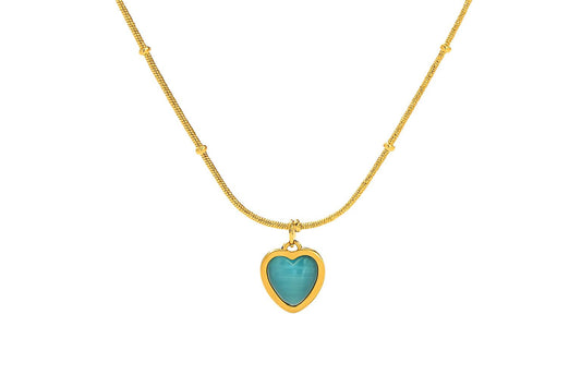 CALISTA Gold Necklace with heart-shaped blue stone pendant on white background