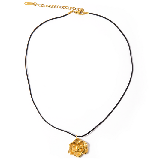 LUMINA Gold Necklace with camellia flower pendant on black cord – white background