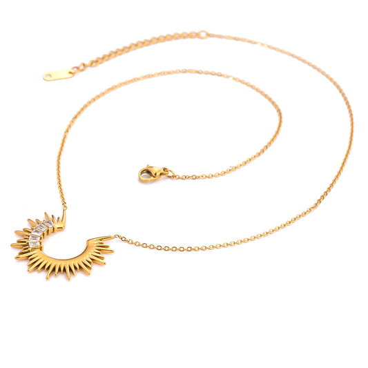 Sunkissed Gold Necklace flat lay on white background – 18K PVD gold sunburst design with zircon stones.