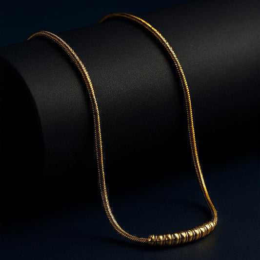 18K gold plated spiral twisted snake chain with polished beads on dark luxury backdrop