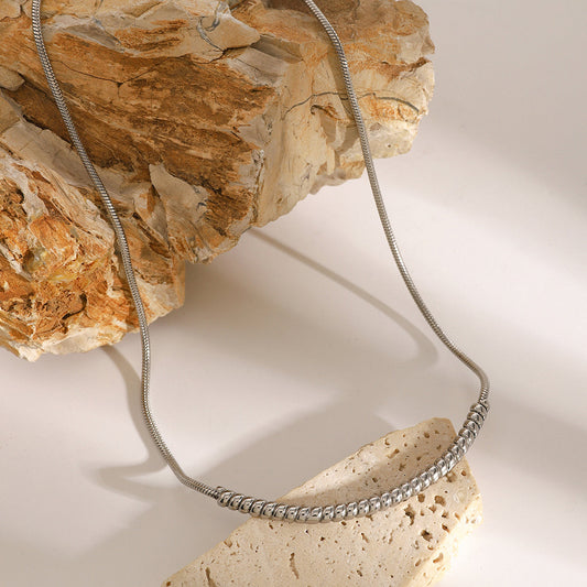 SILVER DAWN NECKLACE – 18K PVD Silver Plated Premium Stainless Steel with spiral bead snake chain on natural stone background